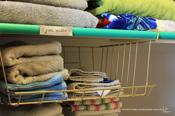 Linen-Closet-Organized-Junk-Towel-Bin