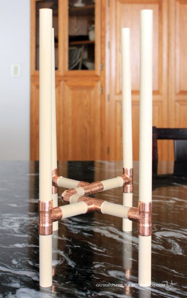 Wood-and-Copper-Plant-Stand-Drying-on-Table