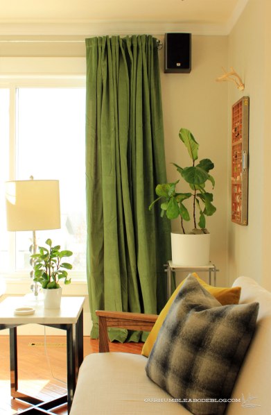 Green-Curtains-in-Living-Room-by-Sofas